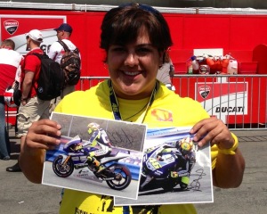 Holding the photos that Rossi autographed for me
